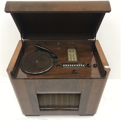  Early 20th century walnut cased Bush RG 64 Radiogram, hinged lid, W82cm, H79cm, D48cm  