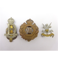  Seven cap badges - 22nd Dragoons, POW 3rd Carabiniers, 13th Hussars, 19th Hussars, 3rd Carabiniers and South African 'Union is Strength' four cavalry cap badges - Queens Own Hussars, Wiltshire Yeomanry, Scottish Horse and Westmorland & Cumberland, and four other badges (15)   