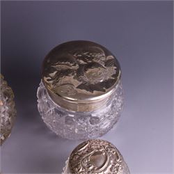 Early 20th century silver mounted cut glass scent bottle, with silver lid and three cut glass dressing table jars with silver lids, all hallmarked 