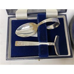 Cased pair of Wedgwood silver-plate book stands, silver-plate baby feeding spoon and pusher in box, other silver-plated cutlery