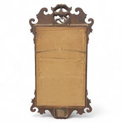 George III mahogany side table, the rectangular moulded top above a single frieze drawer fitted with brass swan neck handles, above a shaped serpentine apron raised upon square section legs, W86 D42 H75cm, together with a George III fretwork mirror, the rectangular plate within a gilt slip surmounted by a pierced crest with inset carved Ho-Ho bird, with shaped apron with gilt shell motif, H84cm W45cm