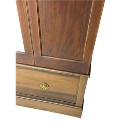 Edwardian inlaid mahogany wardrobe, projecting moulded cornice over central bevelled mirror glazed door, panelled uprights inlaid with trailing bellflowers and foliate decoration, the skirted base fitted with single drawer 
