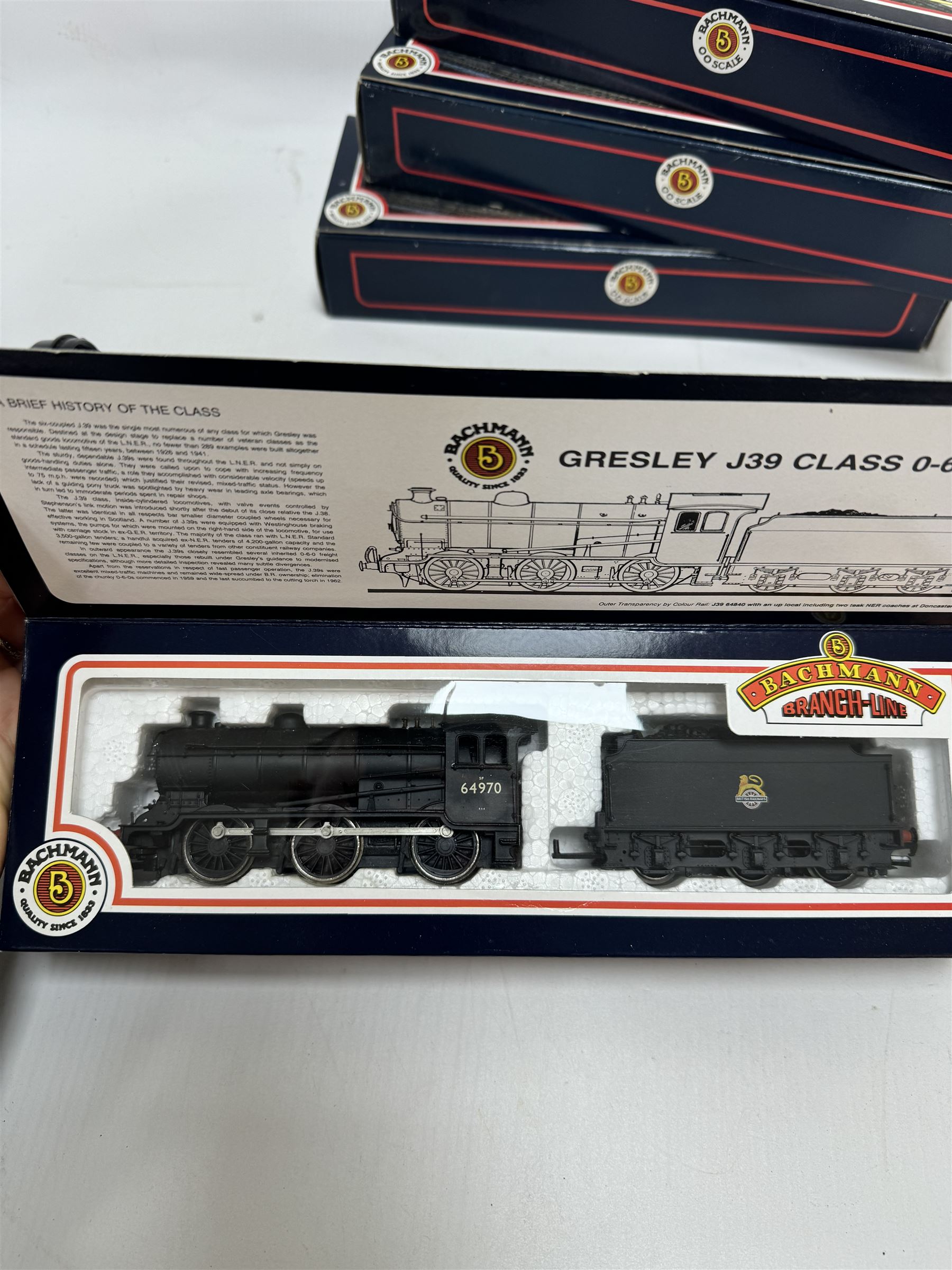 Four Bachmann Branch Line ‘00’ gauge Gresley J39 Class 0-6-0 locomotives, comprising 31851 no.64964 in BR black livery with early crest, 31851A no. 64958 in BR black with early emblem, 31852 no. 64967 in BR black with late crest and 31852A no. 64970 in BR black with late crest, all boxed 
