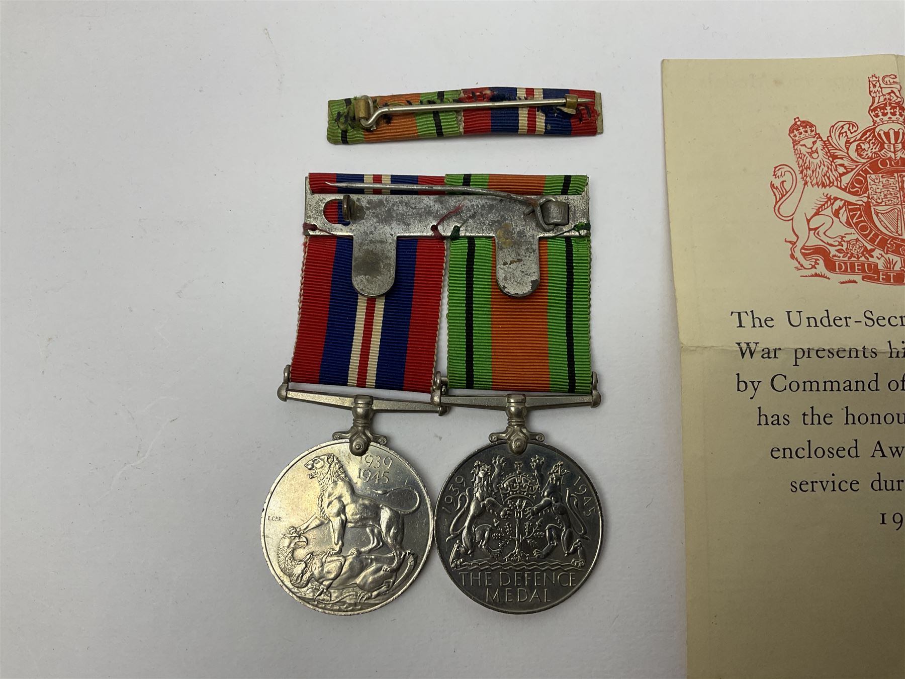 Twelve WW2 medals comprising four 1939-1945 war medals, four Defence medals, three 1939-1945 Stars and Africa Star; all with ribbons; some as groups in two issue boxes with slips