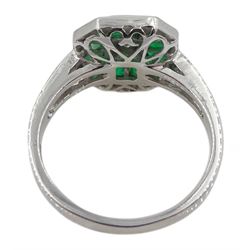 18ct white gold calibre cut emerald and round brilliant cut diamond ring, with diamond set shoulders, stamped 750