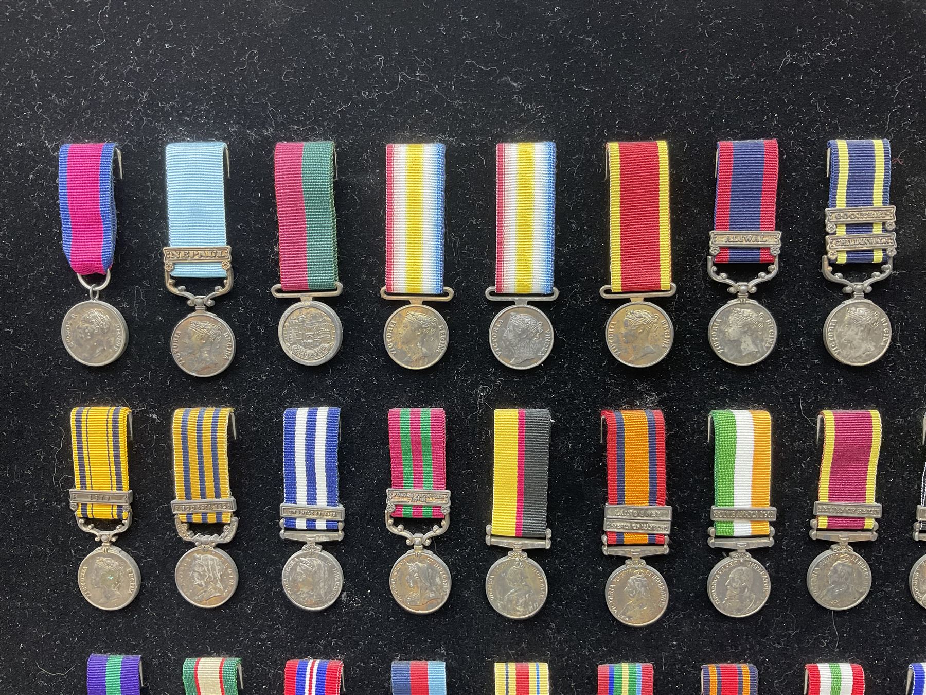 Two limited edition large framed display boards with half-size copies of British Gallantry and Campaign Medals produced by Danbury Mint and entitled 'For Valour'. Sixty medals on each board, all with ribbons. Complete with Danbury Mint certificate serial number A0148 and other paperwork.