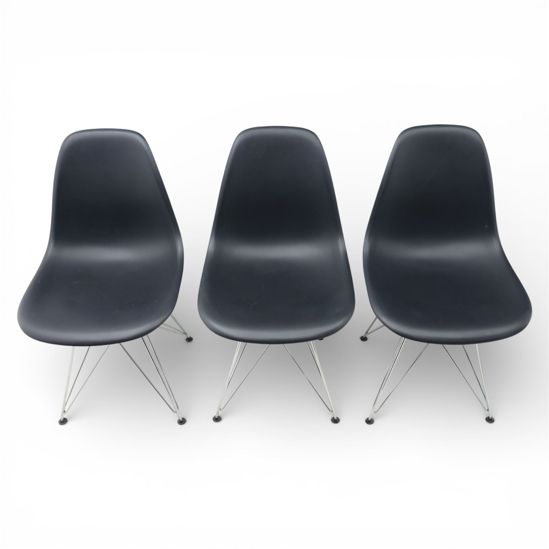 Vitra - set of six DSR side chairs designed by Charles and Ray Eames, moulded black plastic seats, raised on chromed wire Eiffel bases with plastic foot glides