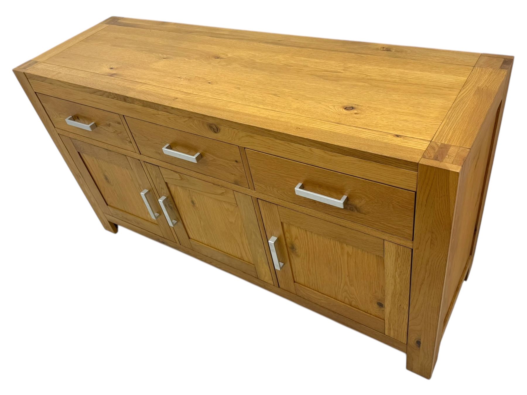 Light oak sideboard, fitted with three drawers and three cupboards, metal handles