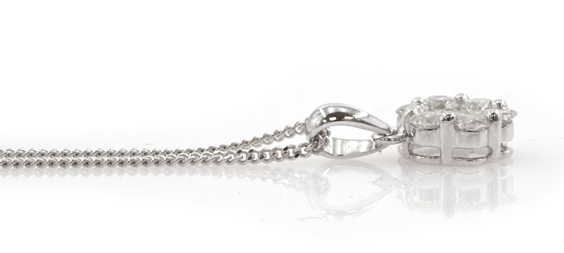 18ct white gold seven stone round brilliant cut diamond daisy flower head cluster pendant, on 9ct white gold chain, total diamond weight approx 0.95 carat