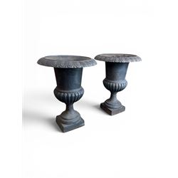 Pair of Victorian design heavy cast iron garden urns, black painted, egg and dart rim on waisted column