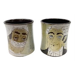 1960s Chelsea Pottery mug decorated with barrister by Joyce Morgan, signed JEM, together with a similar example depicting a doctor, H11.5cm, both signed beneath