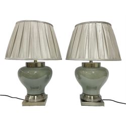 Pair of table lamps of squat baluster form, with a crackle glaze to a dark grey ground, upon a square base, including shade H57cm