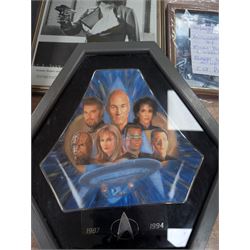 Collection of Star Trek The Next Generation and Deep Space Nine memorabilia, including two limited edition signed Star Trek Deep Space Nine photographs, commemorative porcelain plaque, insignias, Encounter at Farpoint pewter plaque, signed photograph of the Voyager crew, two signed copies of Convergence and a signed War & Madness graphic novel, canvas prints and other signed photos, together with Star Wars Ray Park (Darth Maul) signed photograph, UFO and Buck Rogers memorabilia