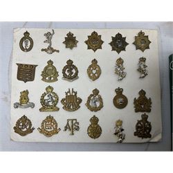 Large quantity of British military cap badges, shoulder titles, collar badges, rank pips, buttons etc, including original and restrikes