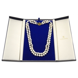  Double strand cultured pearl necklace by Mikimoto, with gold sapphire clasp stamped 9ct, in original box  