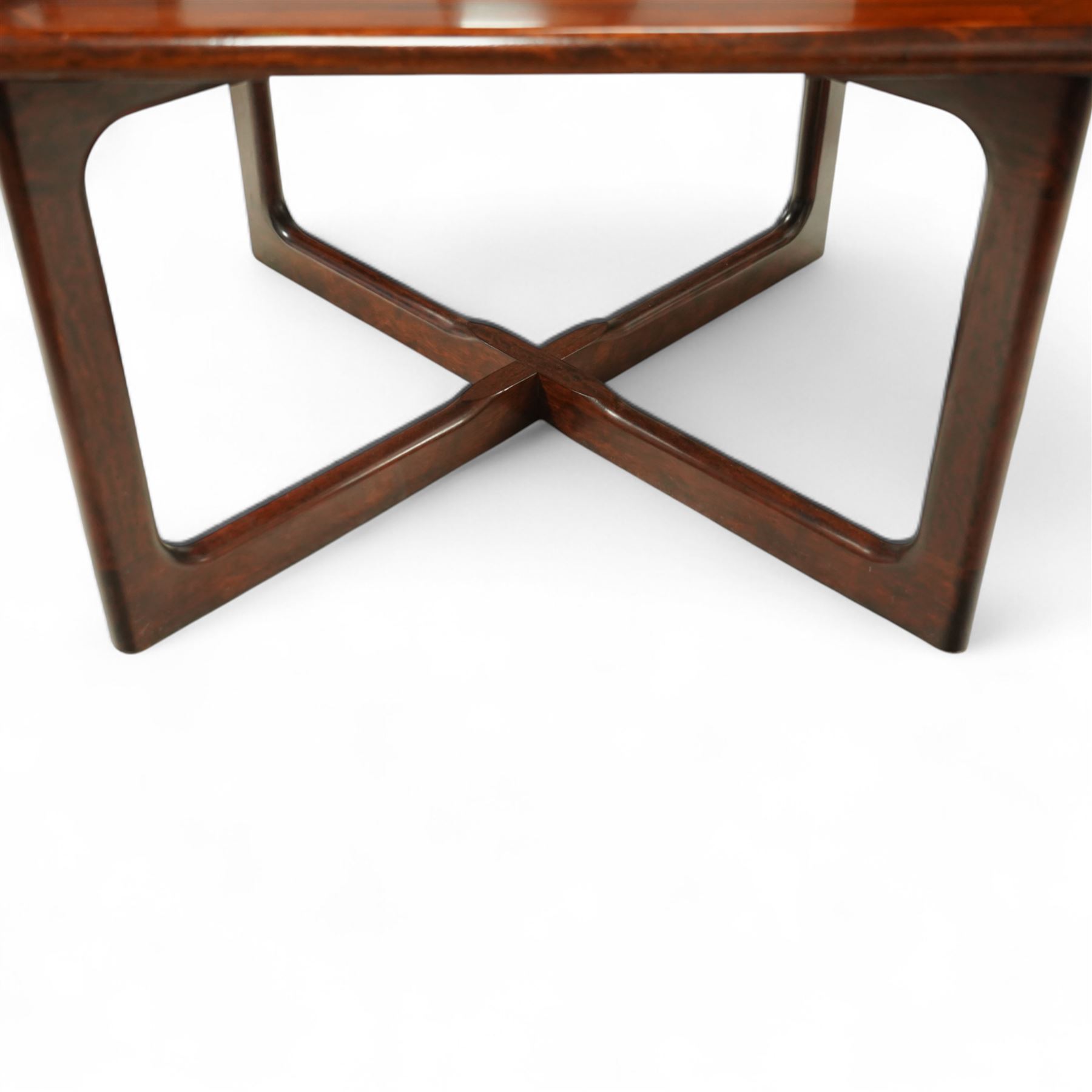 Dyrlund - contemporary Santos rosewood coffee table, floating design, square top of elegant design with clean lines and chamfered square legs 

Note: Dyrlund is a Danish furniture manufacturer known for its high-quality, handcrafted pieces, particularly in the mid-century modern style. Founded in 1960 by Frits Hjerte Dyrlund in Rude, Denmark, the company has remained a family business, now run by the second and third generations. Dyrlund specializes in both home and executive office furniture, focusing on practicality, solid construction, and classic design