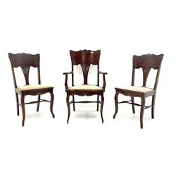 Early 20th century set three (2+1) stained beech beech chairs, raised shaped backs carved with foliage, upholstered seats