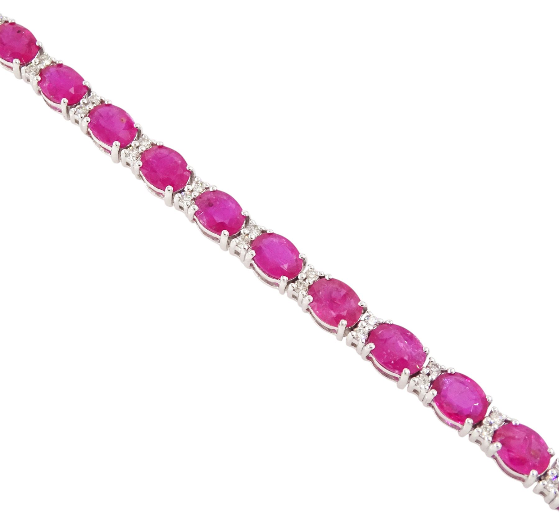18ct white gold ruby and diamond bracelet, twenty-six oval cut rubies, each spaced by two round brilliant cut diamonds, hallmarked, total ruby weight approx 9.40 carat, total diamond weight 0.50 carat