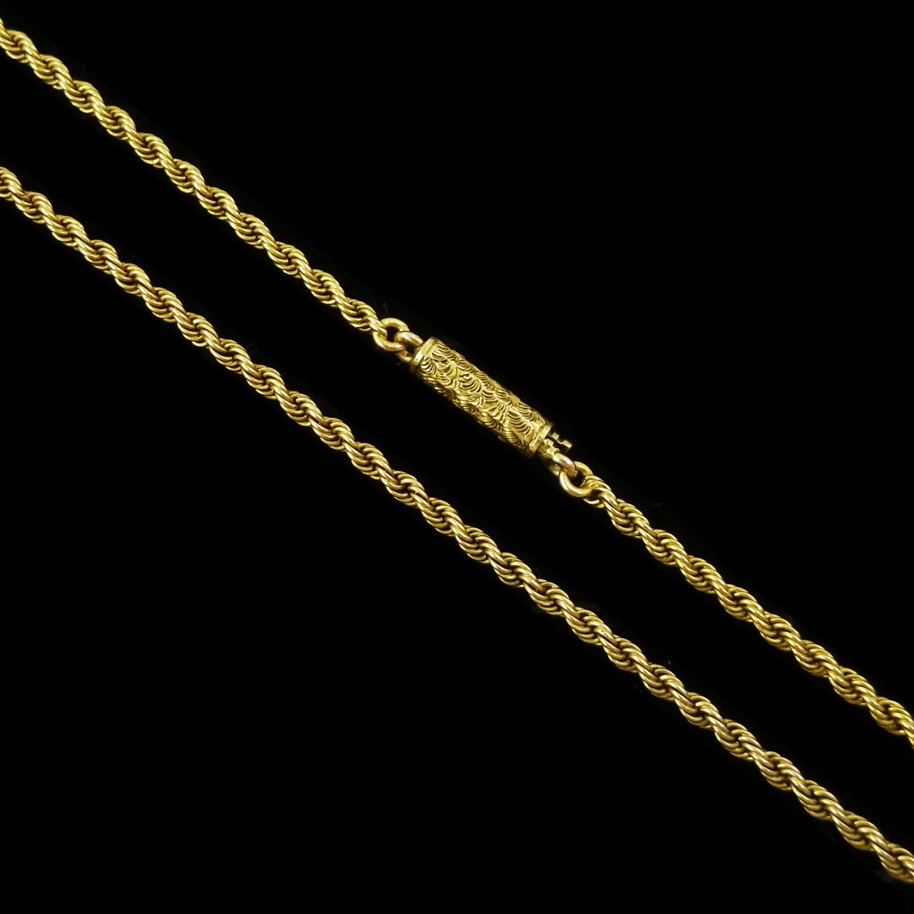 Early 20th century gold rope twist chain necklace, the barrel clasp with engraved decoration, stamped 15