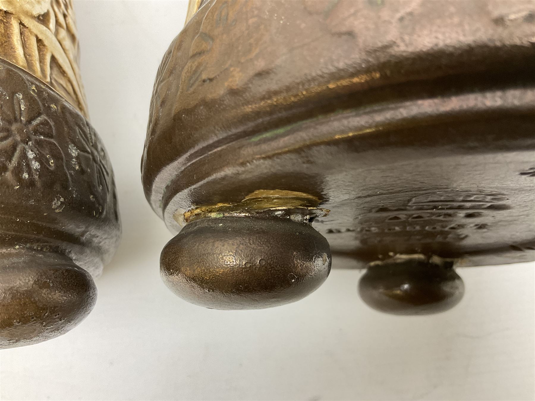 Pair of Bretby vases of tapering cylindrical form decorated with elephants, cranes and fishermen, the bodies with twin elephant mask handles, with coppered borders, raised upon three bun feet, stamped Bretby 2246 marks beneath, H32cm