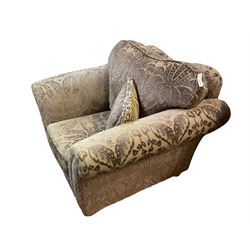 Armchair upholstered in plum fabric decorated with raised floral repeating pattern, with scatter cushions 