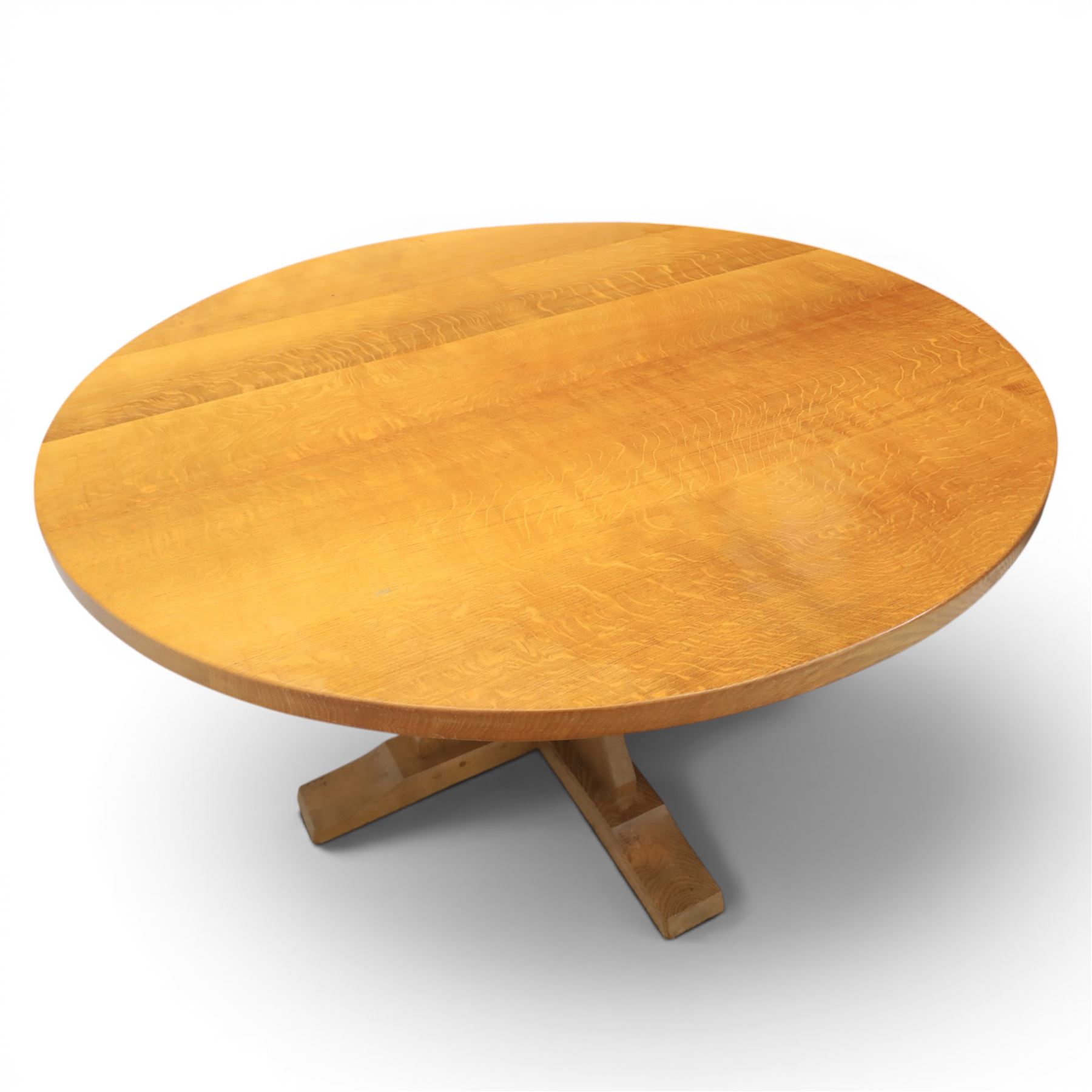 Mouseman - circular adzed oak circular dining table, on quatriform base with carved mouse signature, by the workshop of Robert Thompson of Kilburn