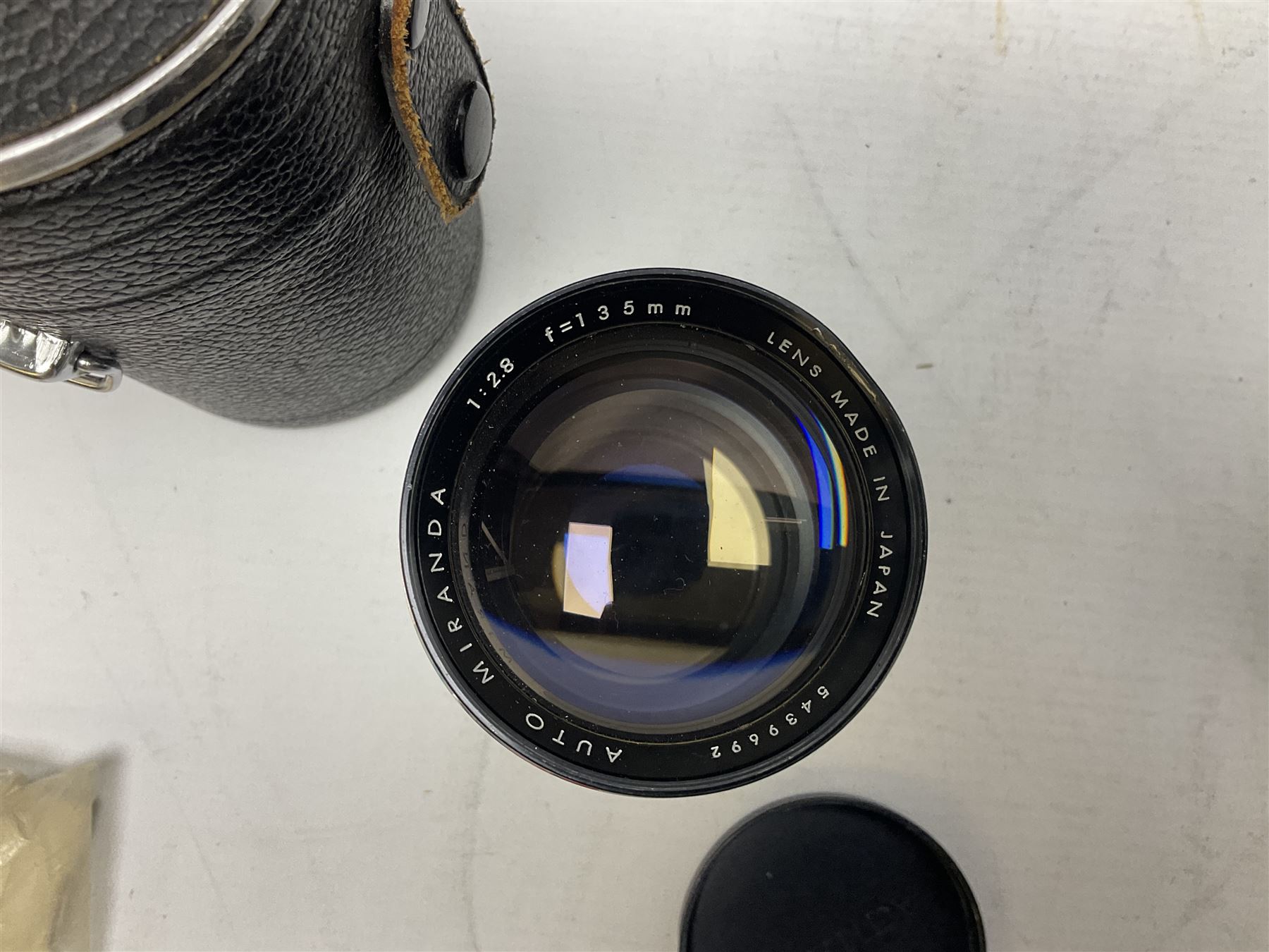 Miranda Sensorex camera body, Miranda Sensorex II camera body with 'Auto Miranda 1:1.8 f-59mm' lens, 'Auto Miranda 1:2.8 f-135mm' lens, 'Auto Miranda 1:3.5 f-200mm' lens, 'Auto Miranda 1:2.8 f-28mm' len, Agfa plate camera with 9cm x 12cm plates and other camera equipment including Miranda camera bag