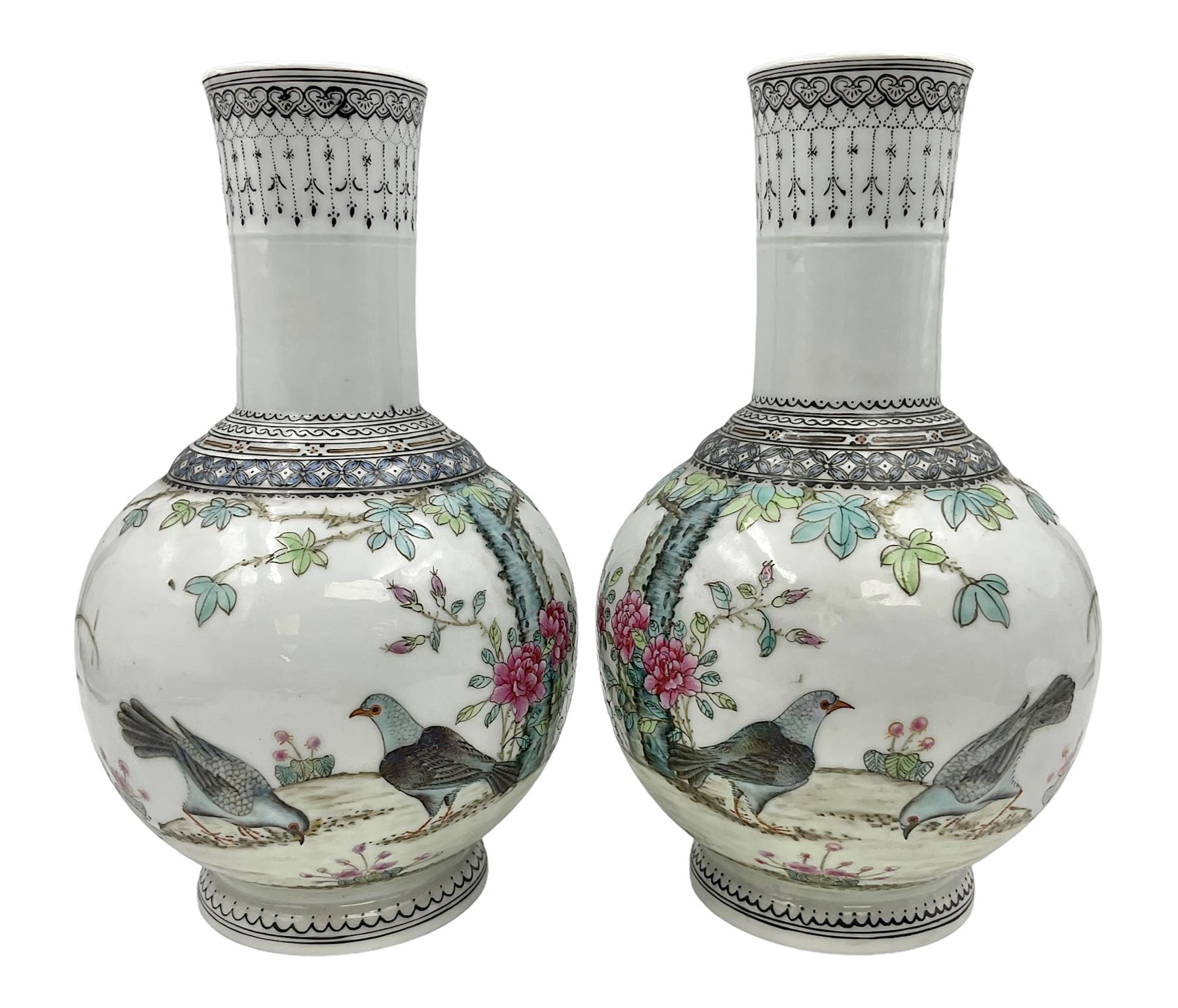 Pair of Chinese Republic porcelain vases, each painted in Famille Rose enamels with pairs of pigeons amidst peony, rock, flowering plants and leafy branches, possibly Qianlong seal beneath, H22cm 