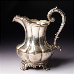 Victorian silver cream jug of panel sided baluster form with crimped rimand scroll handle ...