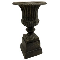 Pair of bronze finish small cast iron classical garden urns, on plinth bases
