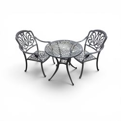 Circular aluminium garden table and pair of armchairs chairs with a pierced and scrolling backs 