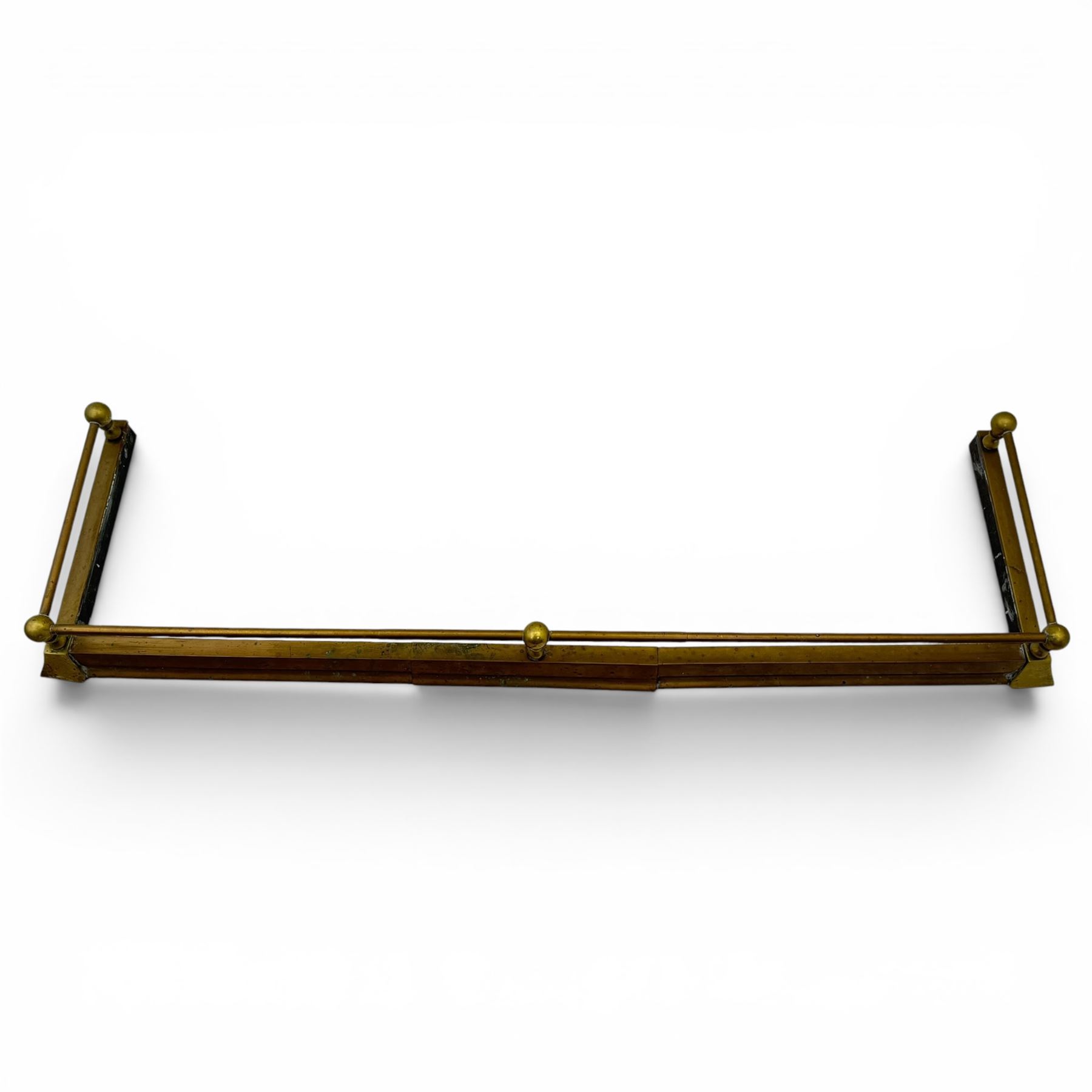 Three 20th century brass fenders, two with pierced Art & Crafts design rails, largest W156cm, D 45cm 