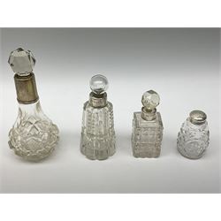 Glass decanter with silver collar and glass stopper, hallmarked John Grinsell & Sons Birmingham date mark worn and indistinct, a glass bowl with a metal and silver lid, hallmark London, maker and date mark worn and indistinct, together with four scent bottles with silver collars, hallmarked and two glass bowls with mounted silver rims, hallmarked