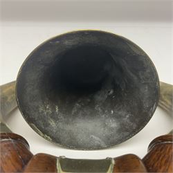 Early 20th century oak and horn dinner bell, the silvered bell suspended from a pair of cow horns, with silver plated mounts and blank shield shaped cartouche, upon square base, H37cm
