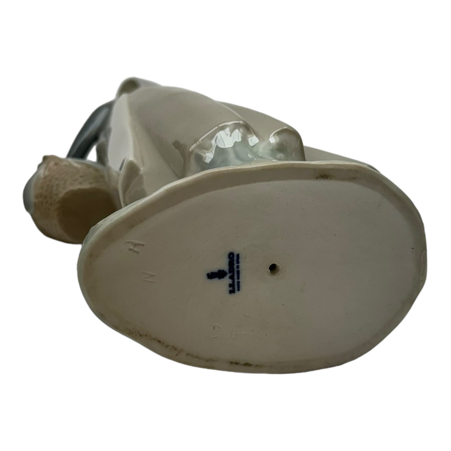 Four Lladro figures, including Market Day no 4502, Girl with Milk Pail no 4682 etc, together with five Nao figures and one other 