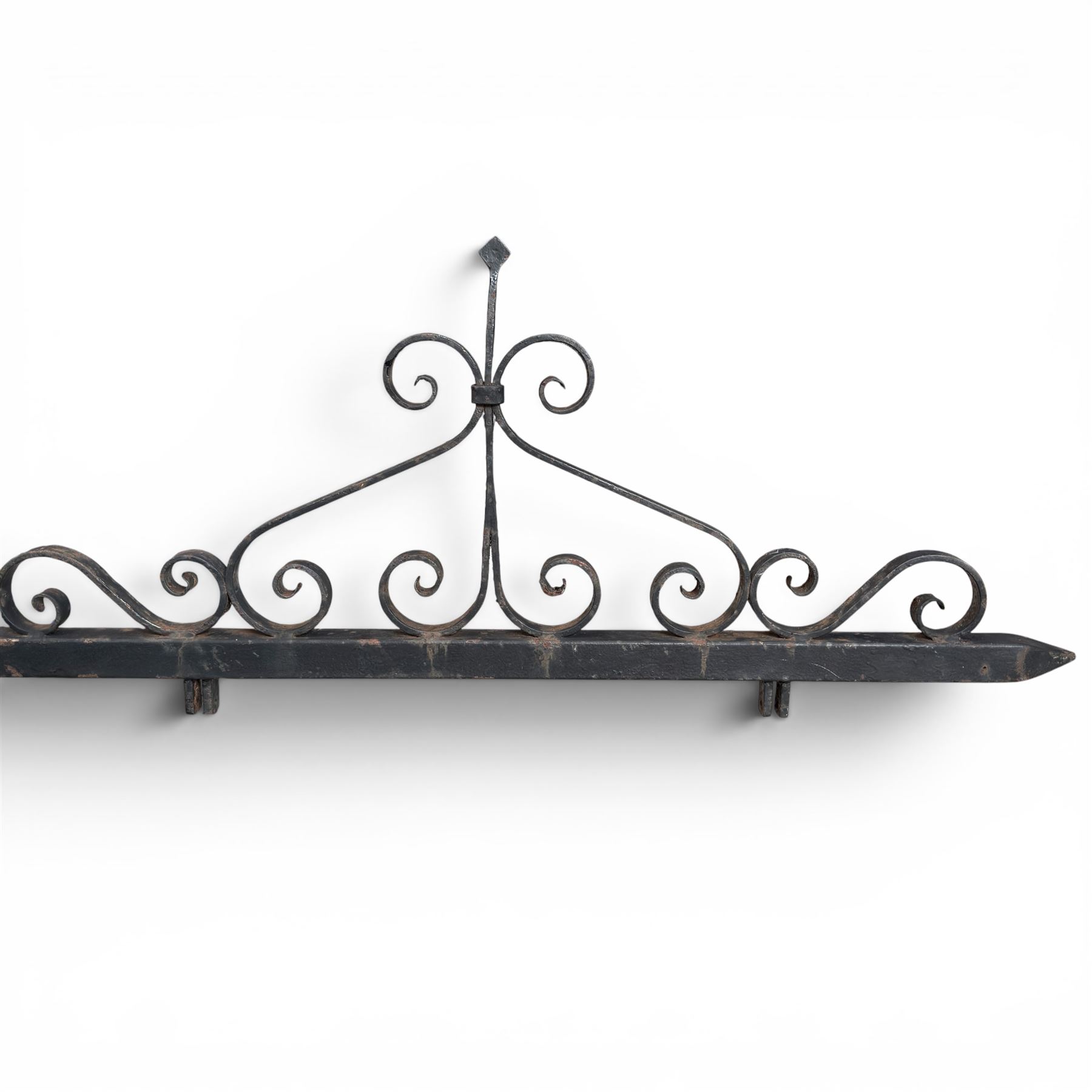 Antique wrought iron sign bracket, with strapwork scroll decoration and arrow form support, in weathered black painted finish