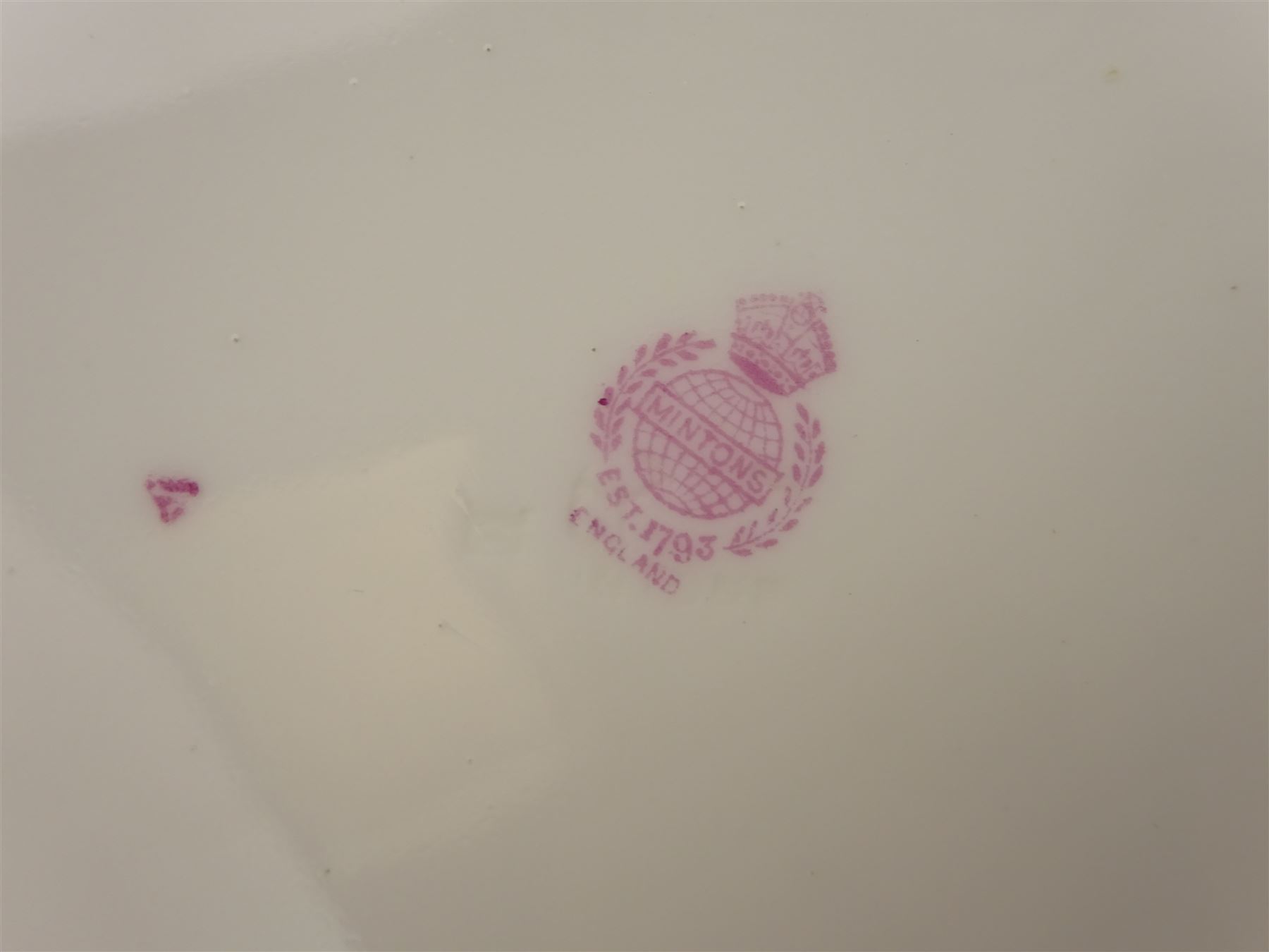 19th century Minton tea set, comprising twelve teacups, eleven saucers, fifteen side plates, cream jug, slop bowl, and two cake plates, decorated with panels of floral sprays, upon a green ground, heightened with gilt throughout, with printed puce mark beneath, and pattern number 5329
