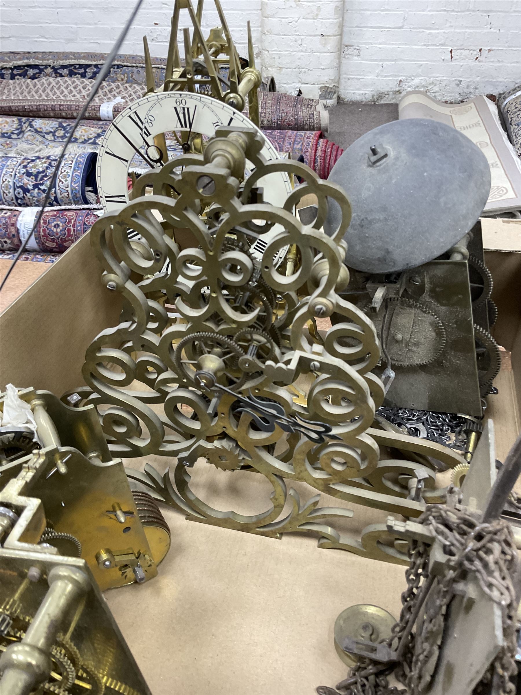 Two skeleton clock movements, tavern clock movement, and further clock movements, all for restoration 