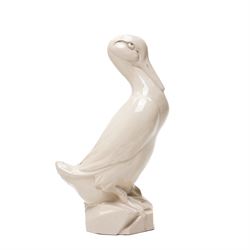 Early 20th century glazed figure of a duck perched upon a rock, signed 'E Grater' and dated 1935, H30cm 