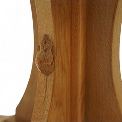 Mouseman - octagonal occasional table, raised on a cruciform base with arched supports, carved with signature mouse to one side, by the workshop of Robert Thompson, Kilburn