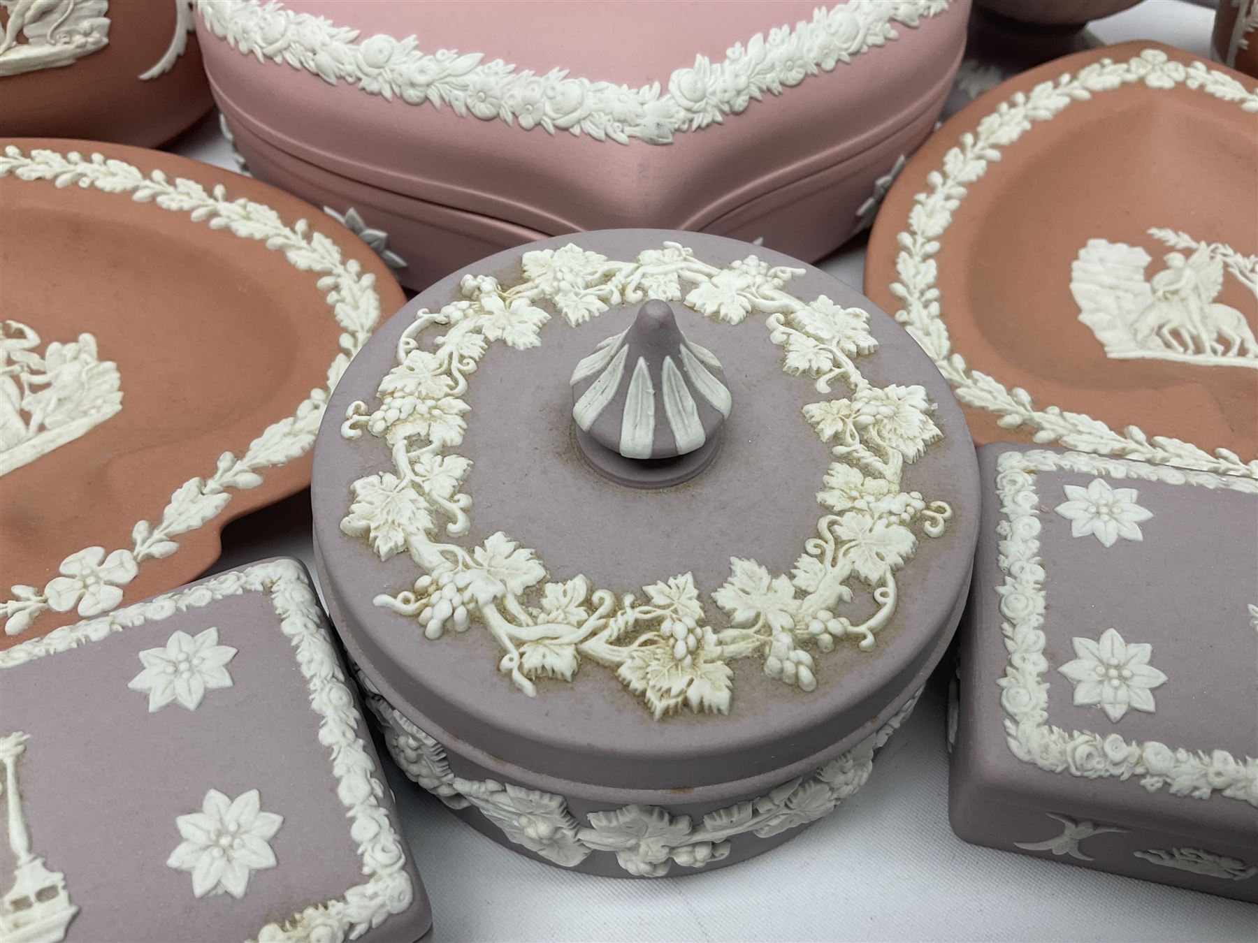 Collection of Wedgwood Jasperware, in orange, lilac and pink colourways, including oval tray, small jug, trinket boxes, trinket dishes, etc , all with impressed mark beneath