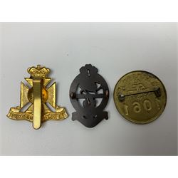 Thirty-six British metal and cloth badges including RAOC, Wiltshire Regiment, West Yorkshire Regiment, ARP, Princess of Wales's etc