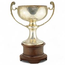 'The Harry Preston Memorial Challenge Cup 1929' - A two handled cup on pedestal base and wooden plinth marked Elkington & Co. H37cm overall Chester 1929 Maker Fattorini & Son