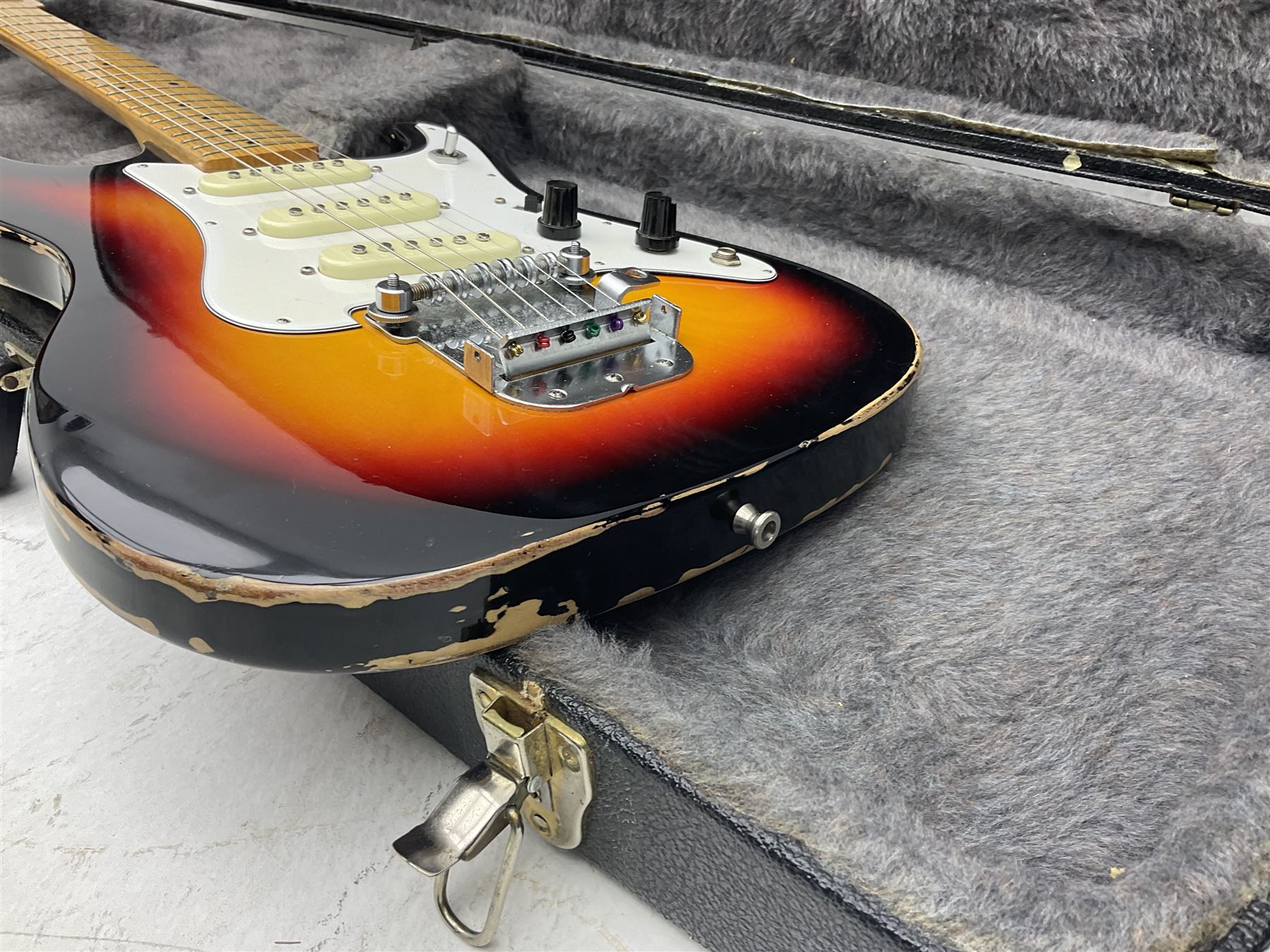 Fender style sunburst electric guitar with manuscript mark 'Zenta Stratocaster 1963' L97cm; in hard carrying case; another similar unmarked sunburst electric guitar; in gig bag; and Fender Frontman Amplifier, serial no.M473406 (3)