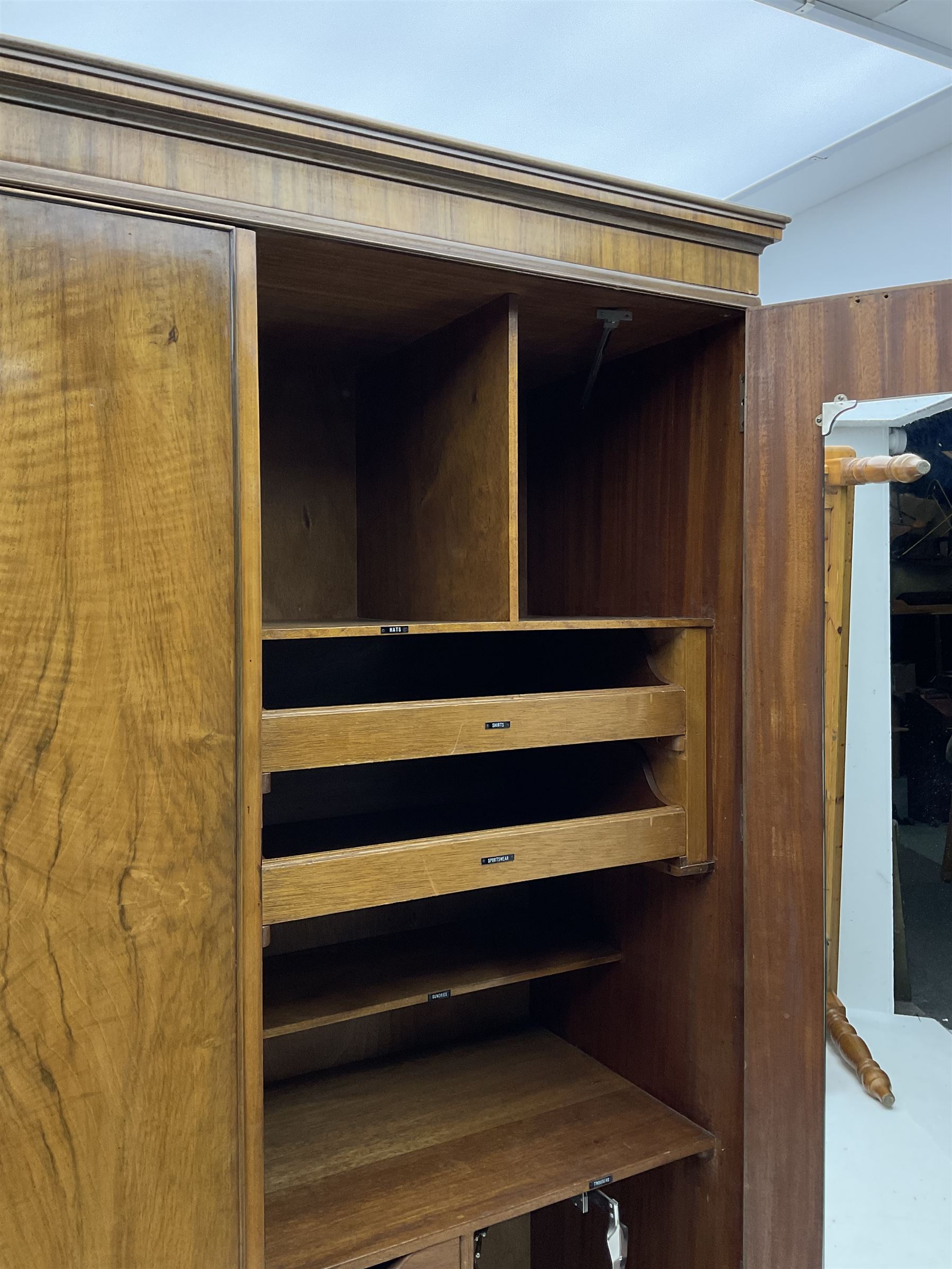 Waring and Gillow - early to mid 20th century figured walnut Gentleman’s wardrobe, two doors enclosing various compartment, mirror, drawers and hanging space, labelled 
