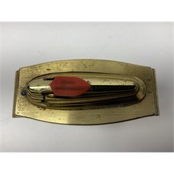 Ronson gilt metal table lighter, together with a silver-plate table lighter in the form of a football boot