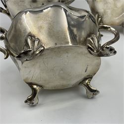 Five piece Edwardian silver tea service, comprising teapot and coffee pot, each with ebonised scroll handle, tea caddy with hinged cover, twin handled open sucrier, and milk jug, each of rounded bombe form, upon four paw feet, hallmarked William Adams Ltd, Birmingham 1904 and 1905, coffee pot H26cm
