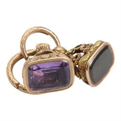 Two late 18th/early 19th century gold fob seals, the first 12ct example with amethyst matrix engraved with the letter D, the second 18ct example with bloodstone matrix, each within a foliate mount united by two 14ct ouroboros snake split rings, each seal approximately H2.5cm

Provenance: By family descent from the Chichesters of Arlington Court, Devon; from the collection of Andrew Chichester Everitt.