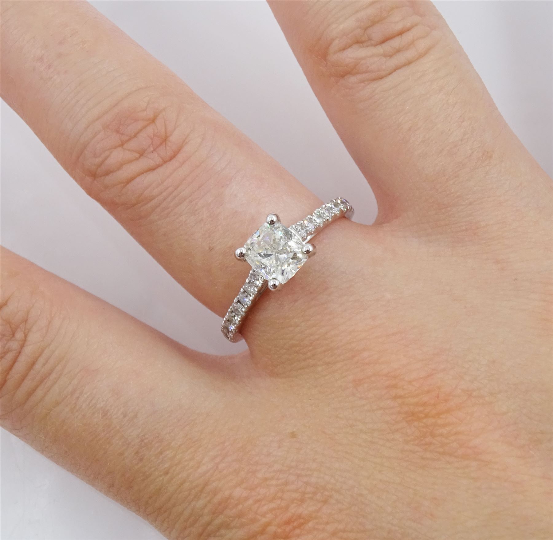 18ct white gold single stone cushion cut diamond ring, with diamond set shoulders, hallmarked, principal diamond 1.01 carat, with International Gemological Institute Report
