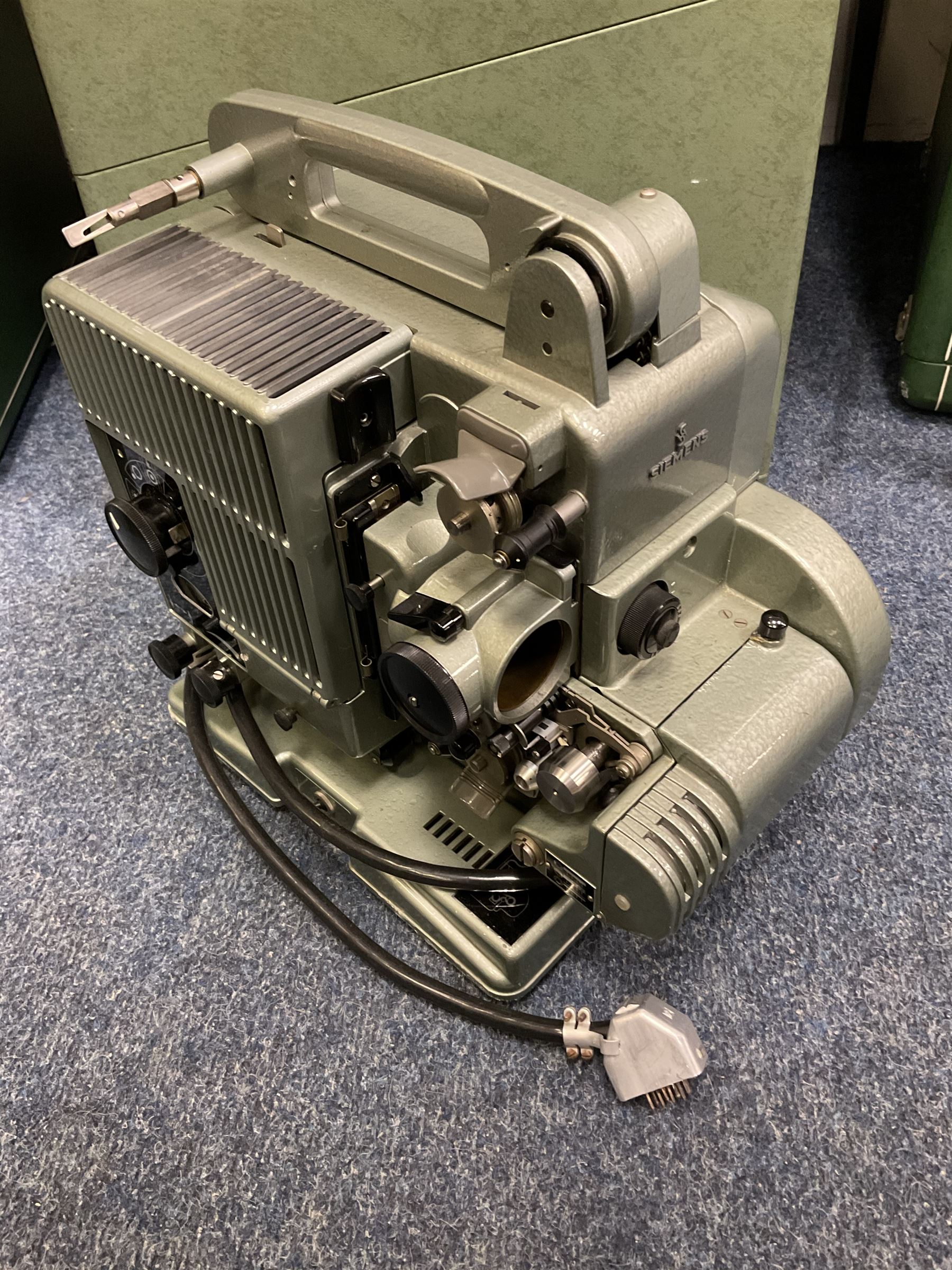 Group of vintage Siemens projectors and various speakers, all housed in